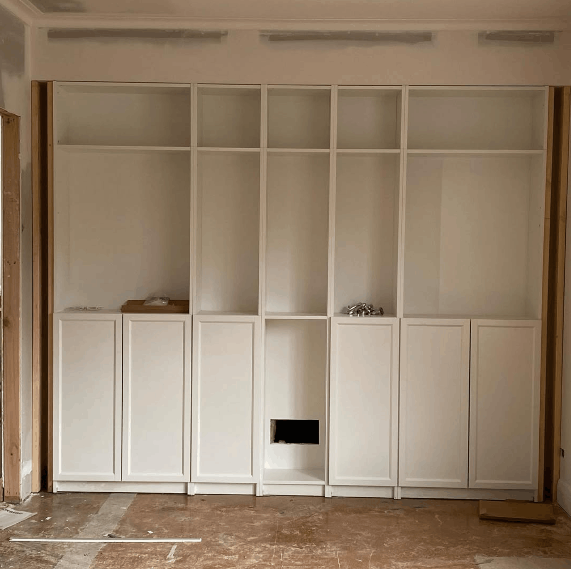 Custom built-in joinery and shaker cabinetry ready for paint